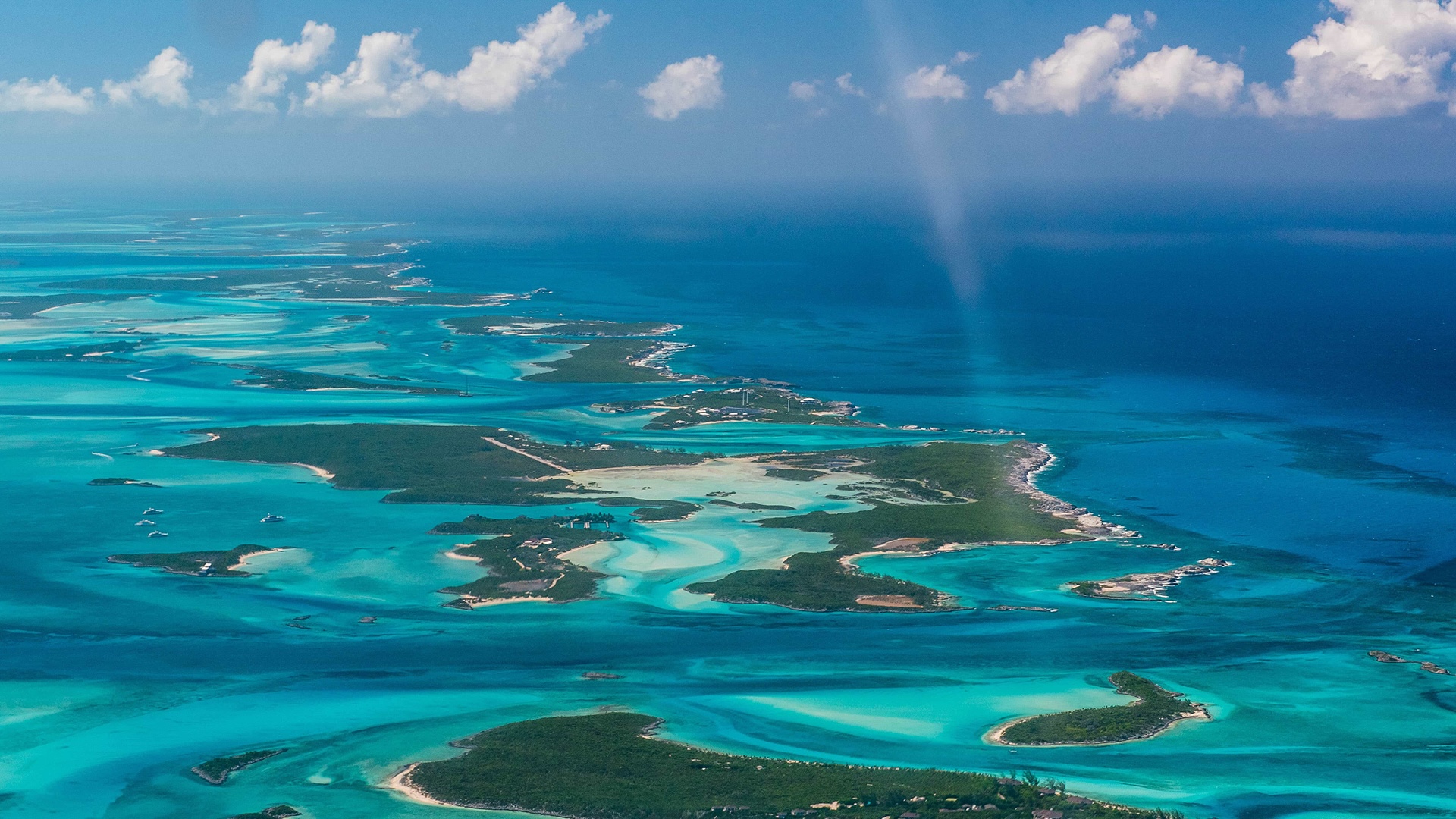 Wide aerial of the northern Exumas with multiple low cays and sandbars