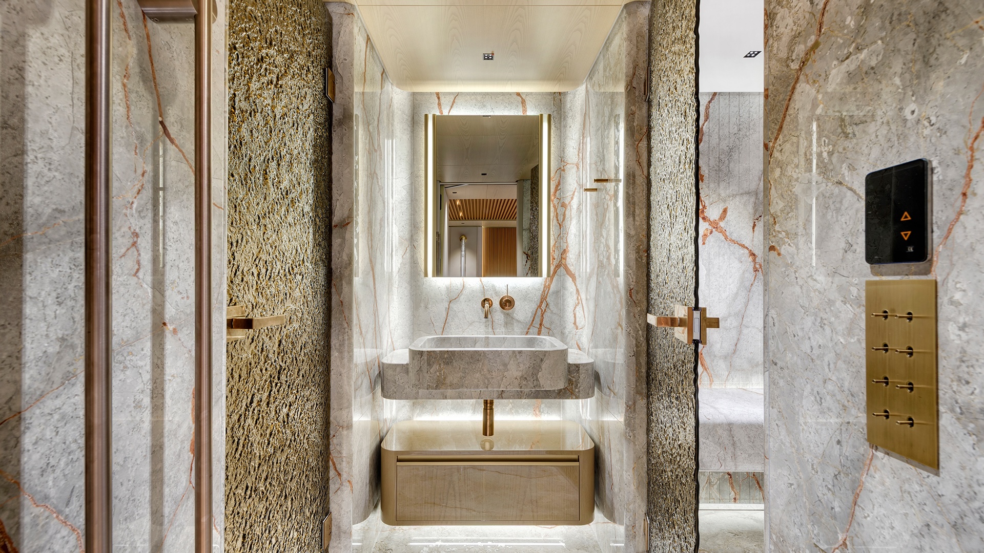 Master bathroom of the Alia 43M in fantastic grey marble with copper and brass veining