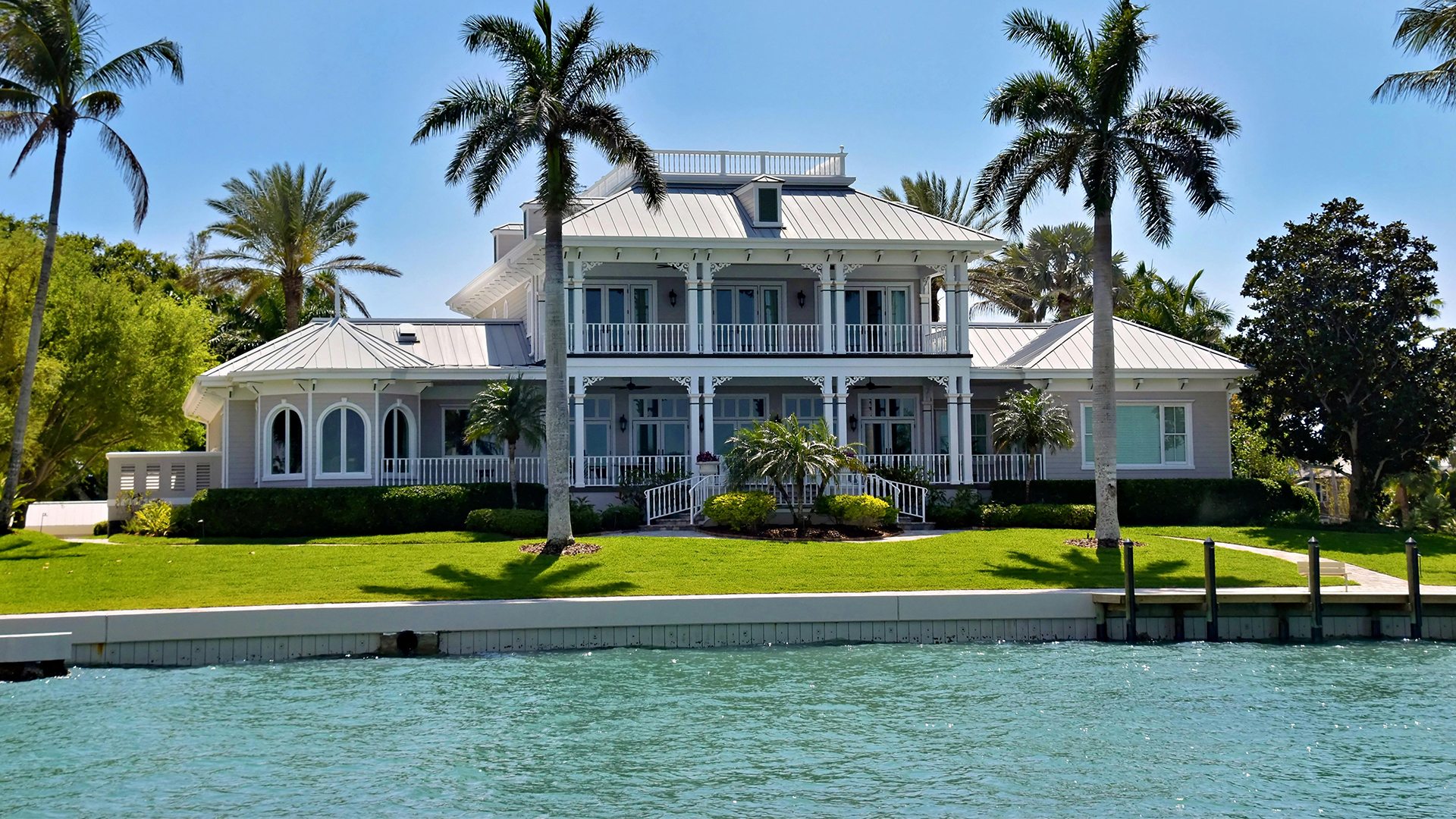 Tudor-style waterfront estate viewed from the water