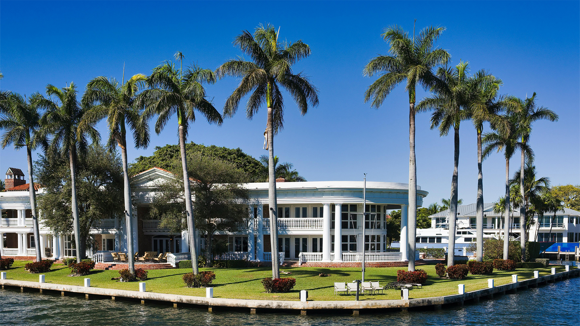 Classic-style American waterfront home seen from the water