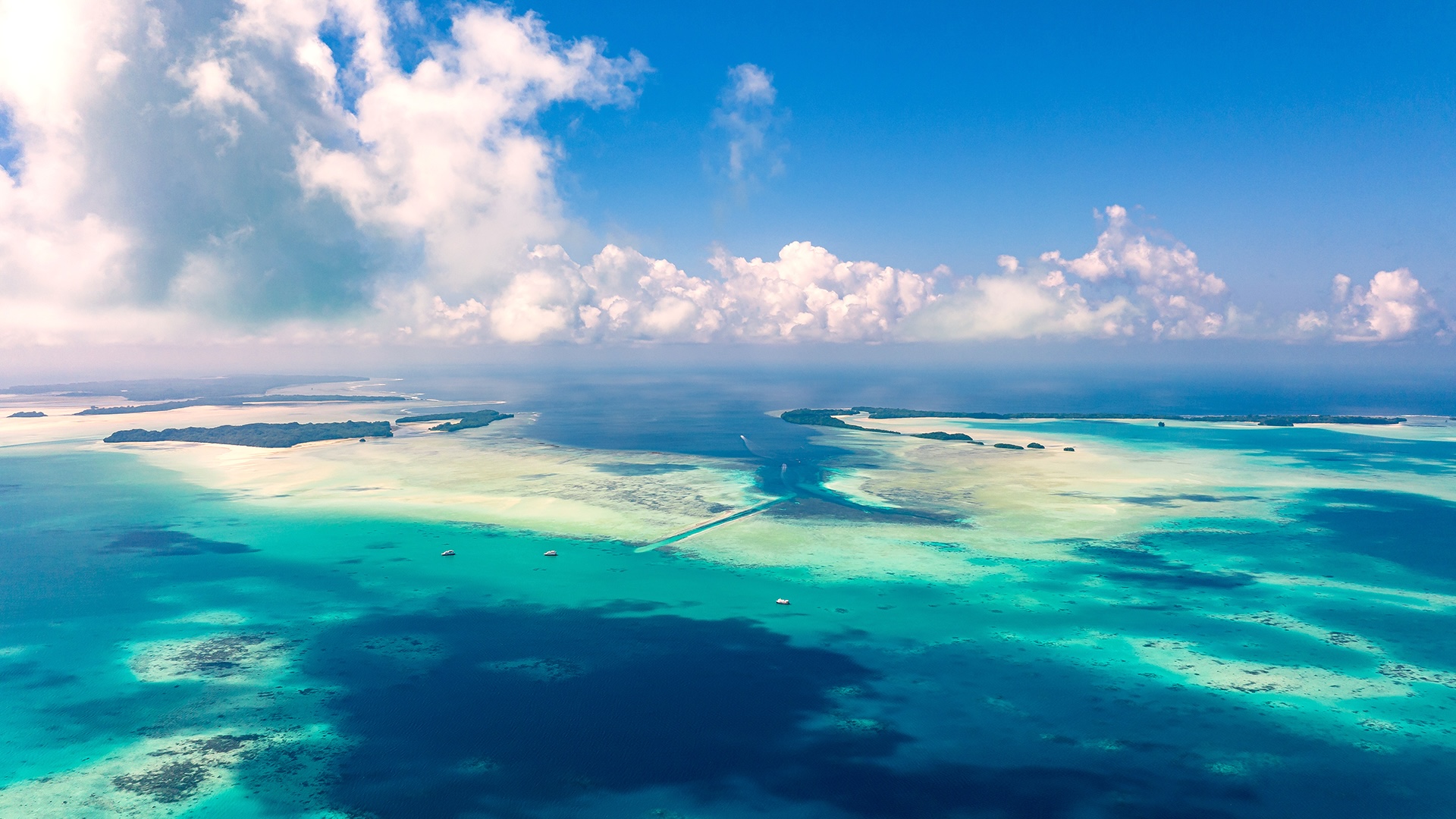 Aerial view of a cluster of islands in the Bahamas