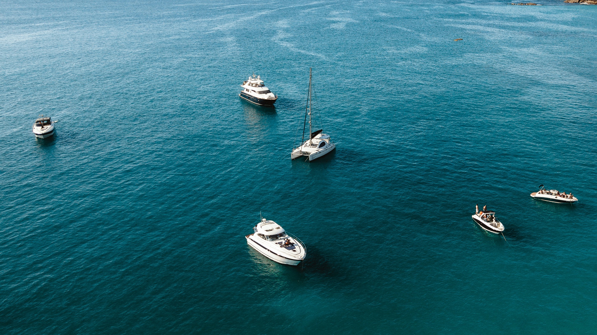Yacht at anchor in a quiet bay