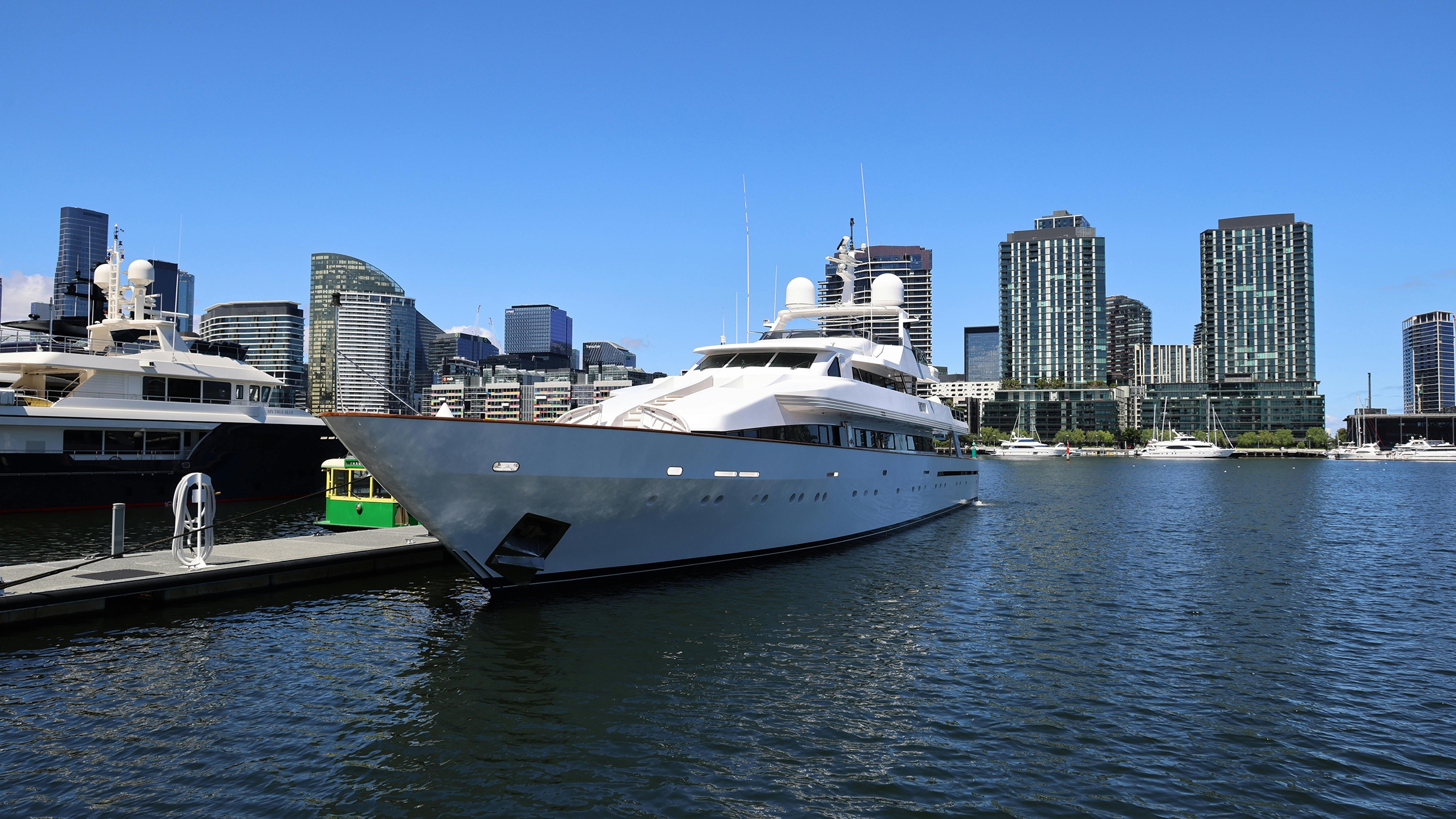 A boat tied up at a marina slip