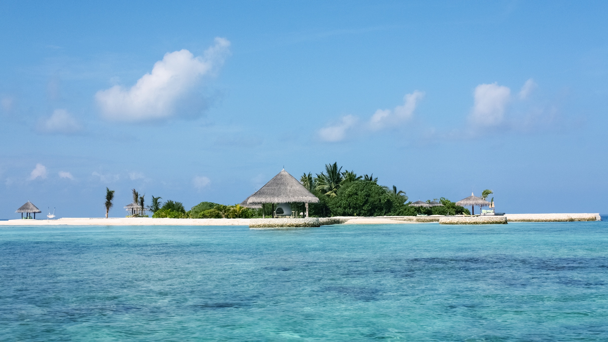 Private island with a beach pavilion seen from the water
