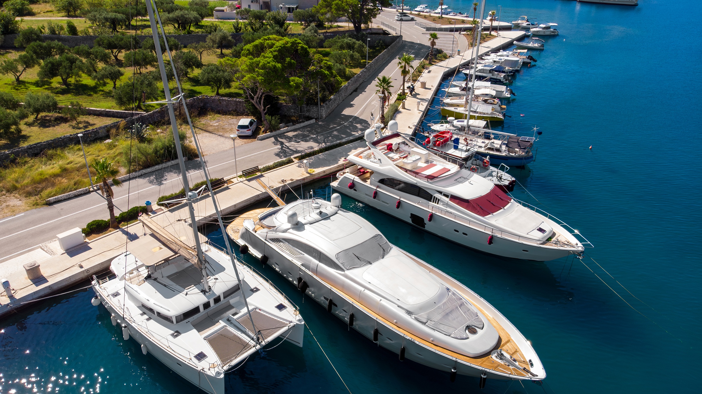 Aerial drone view of boats stern-tied along a marina