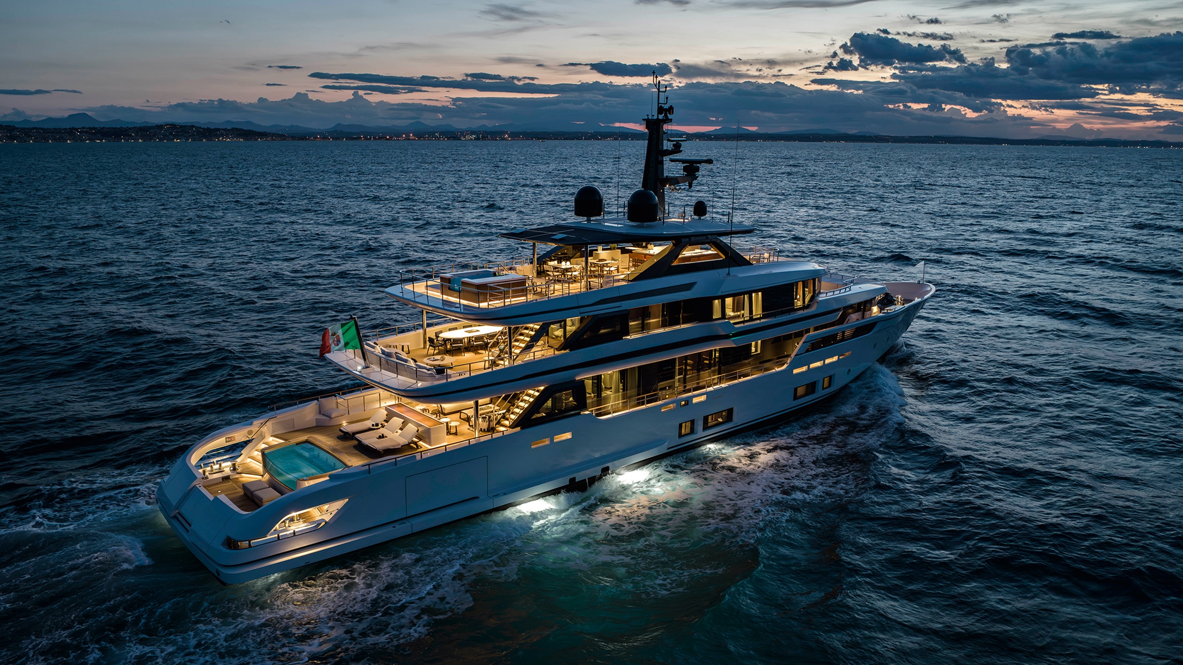 Custom Line 50 stern profile at sunset with all lights on