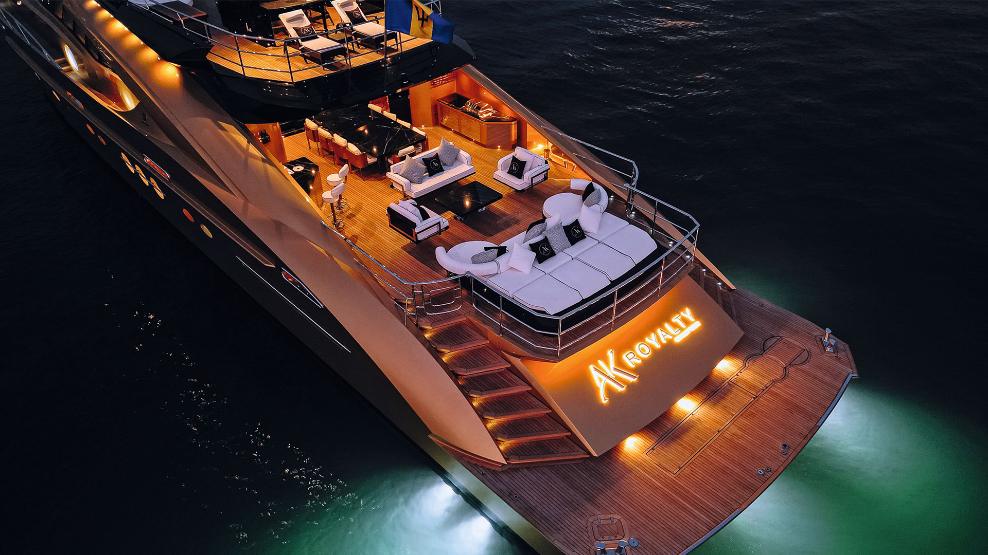 AK Royalty stern illuminated at night