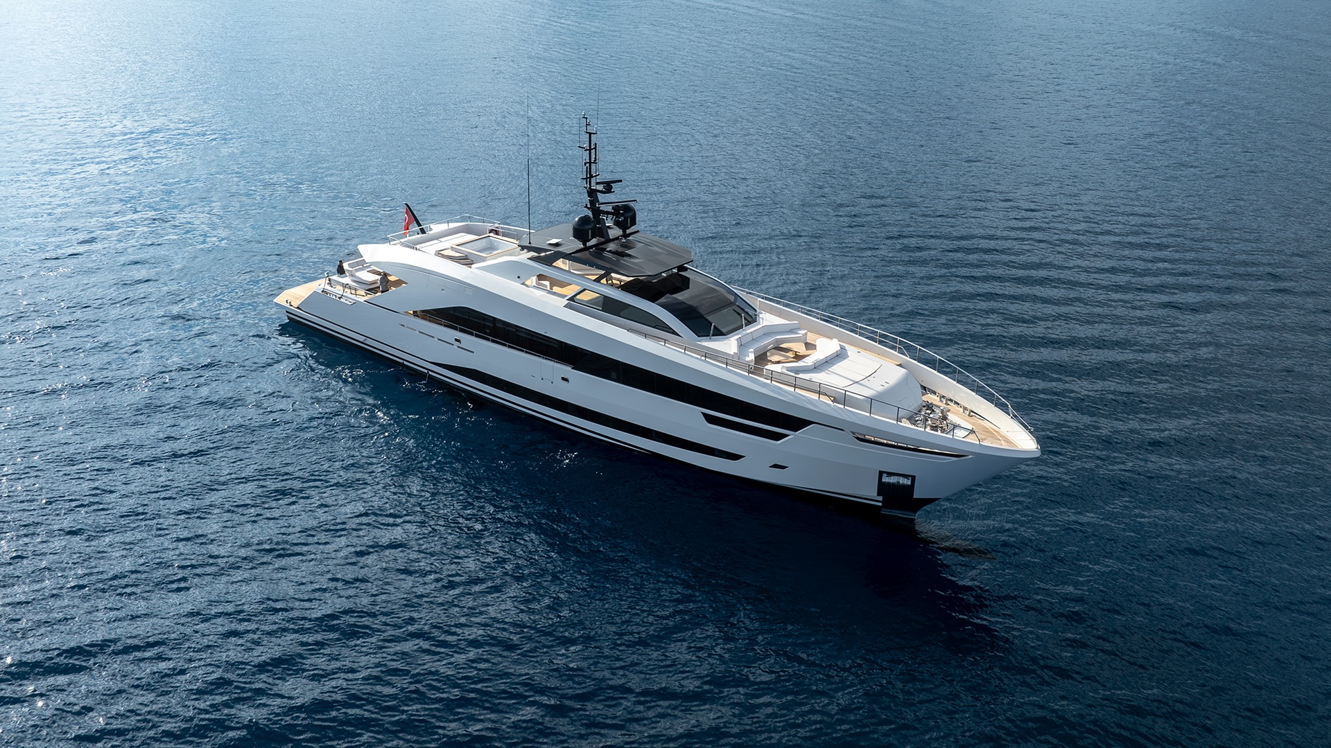 Aerial view of the Alia 43M at anchor, showing the two-and-a-half deck profile and tender platform