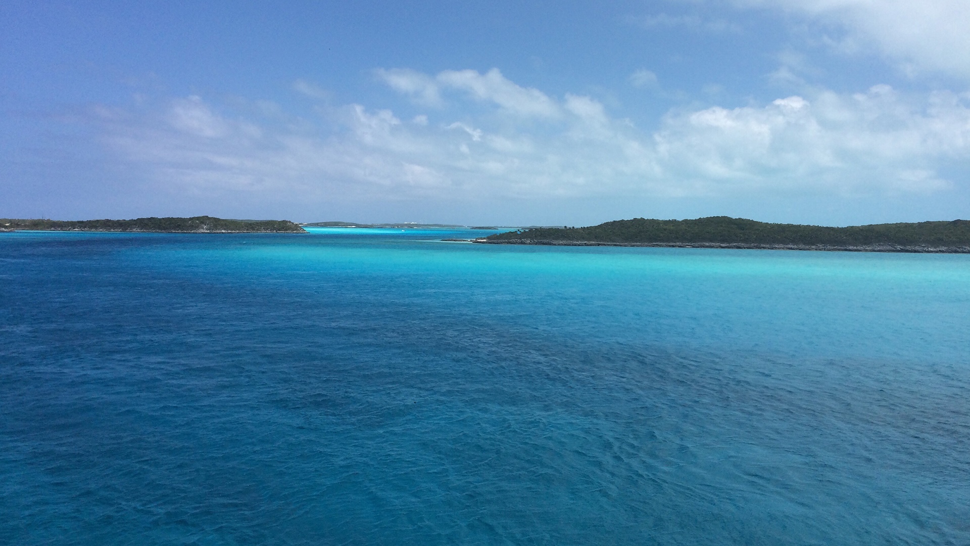 Open water with low cays in the distance, Exumas approach