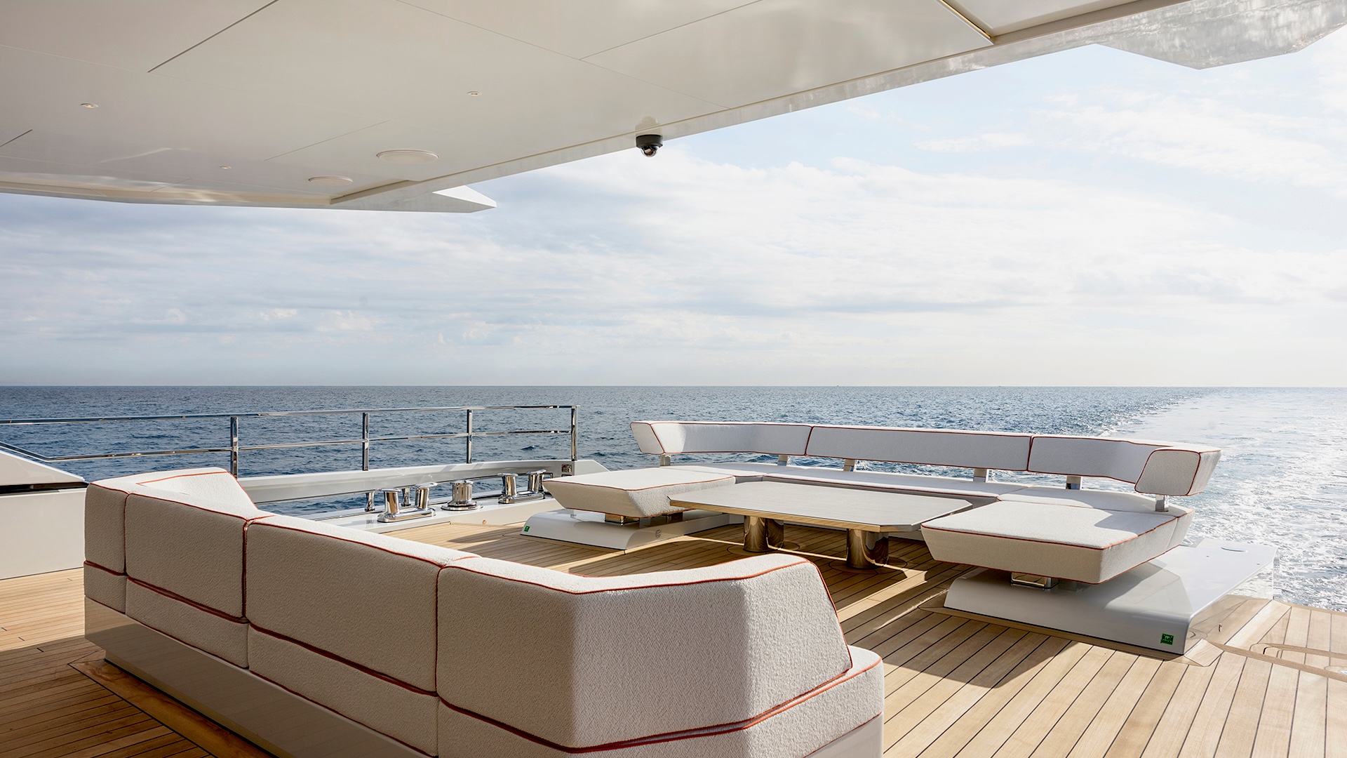 Aft main deck of the Alia 43M, with covered seating and integrated lighting