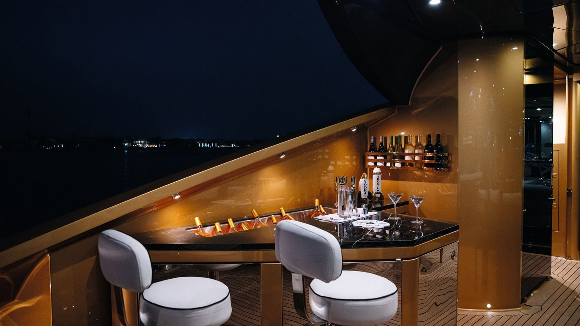 Aft cockpit bar at night on AK Royalty