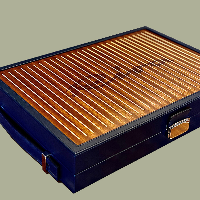 Riva Backgammon Set, closed, lid showing the Riva name inlaid in steel.