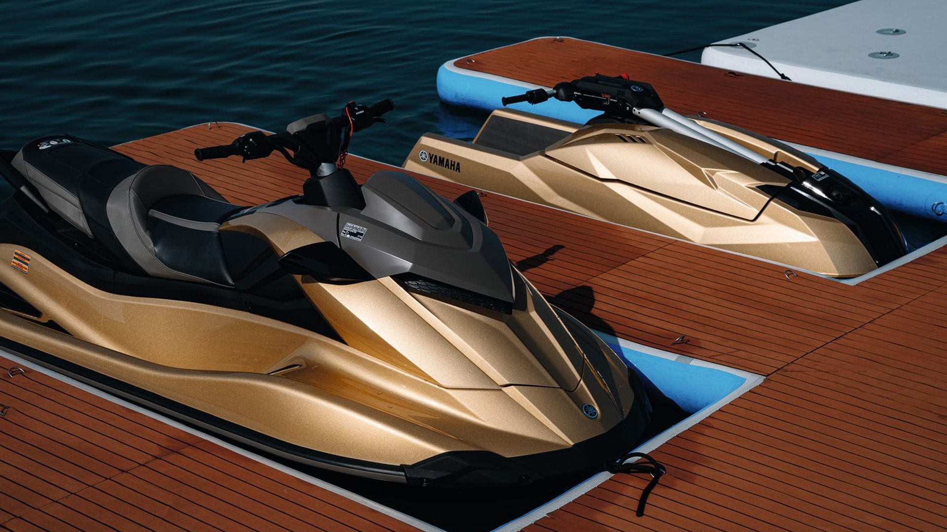 Gold-finished WaveRunner and stand-up paddle aboard AK Royalty