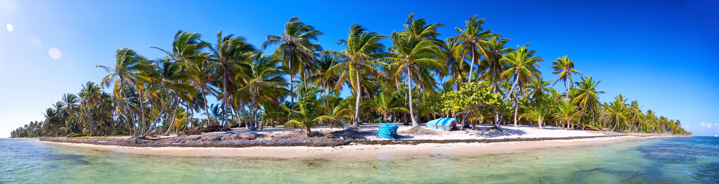 Panoramic view of a private island's coastline at water level