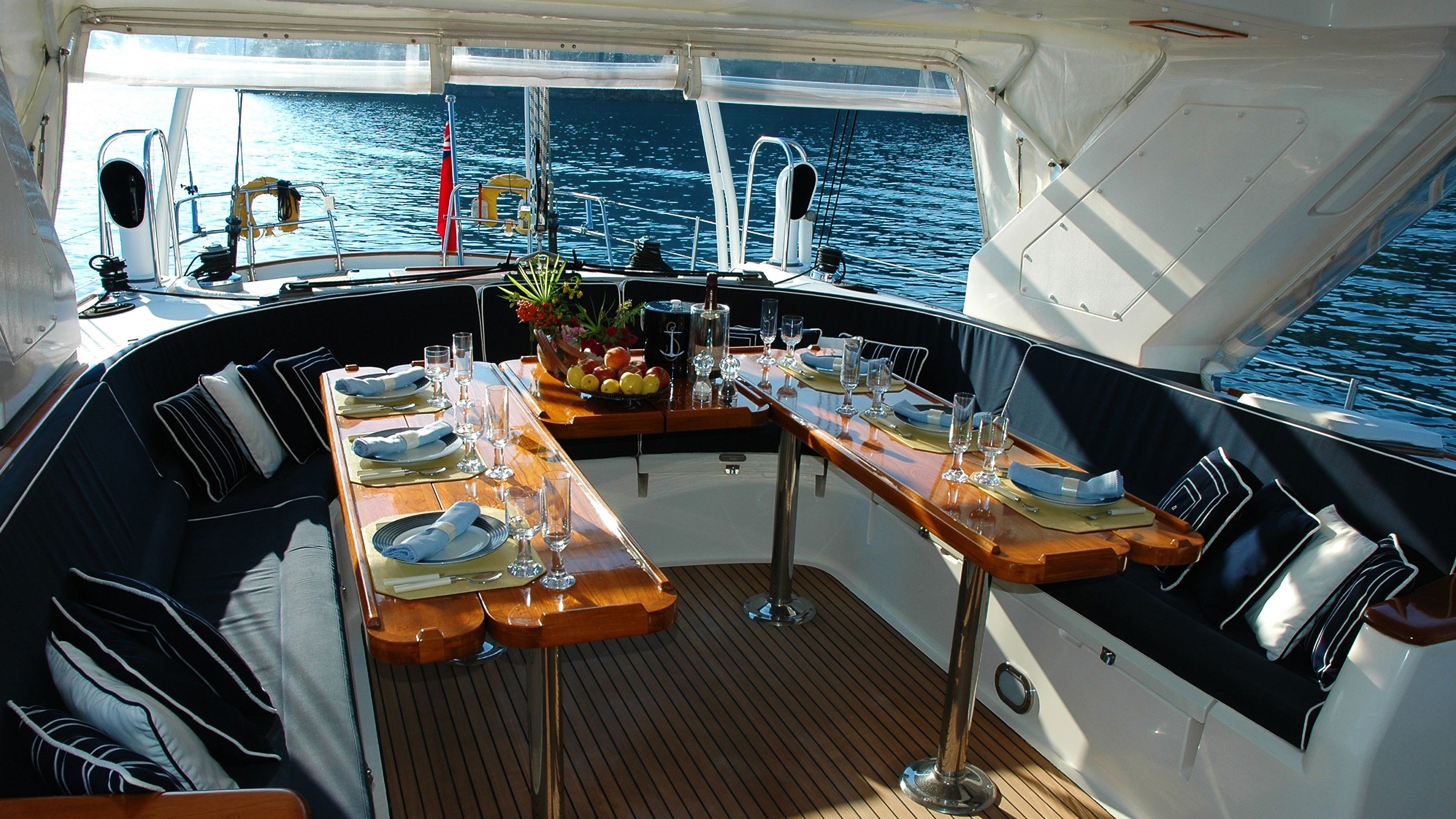 A table set for lunch in the cockpit of a large sailing yacht