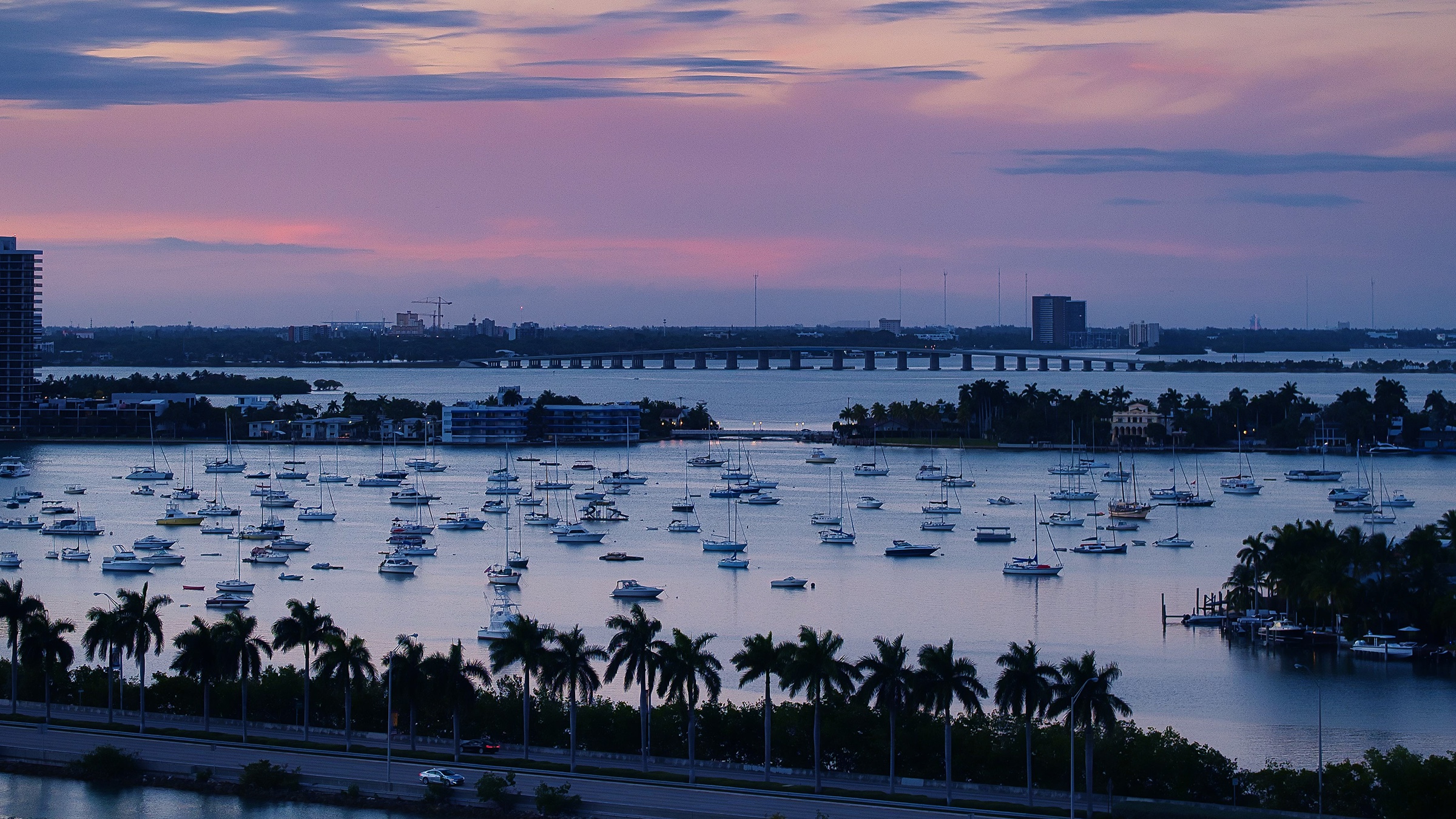 Aerial view of sailboats on moorings at sunset