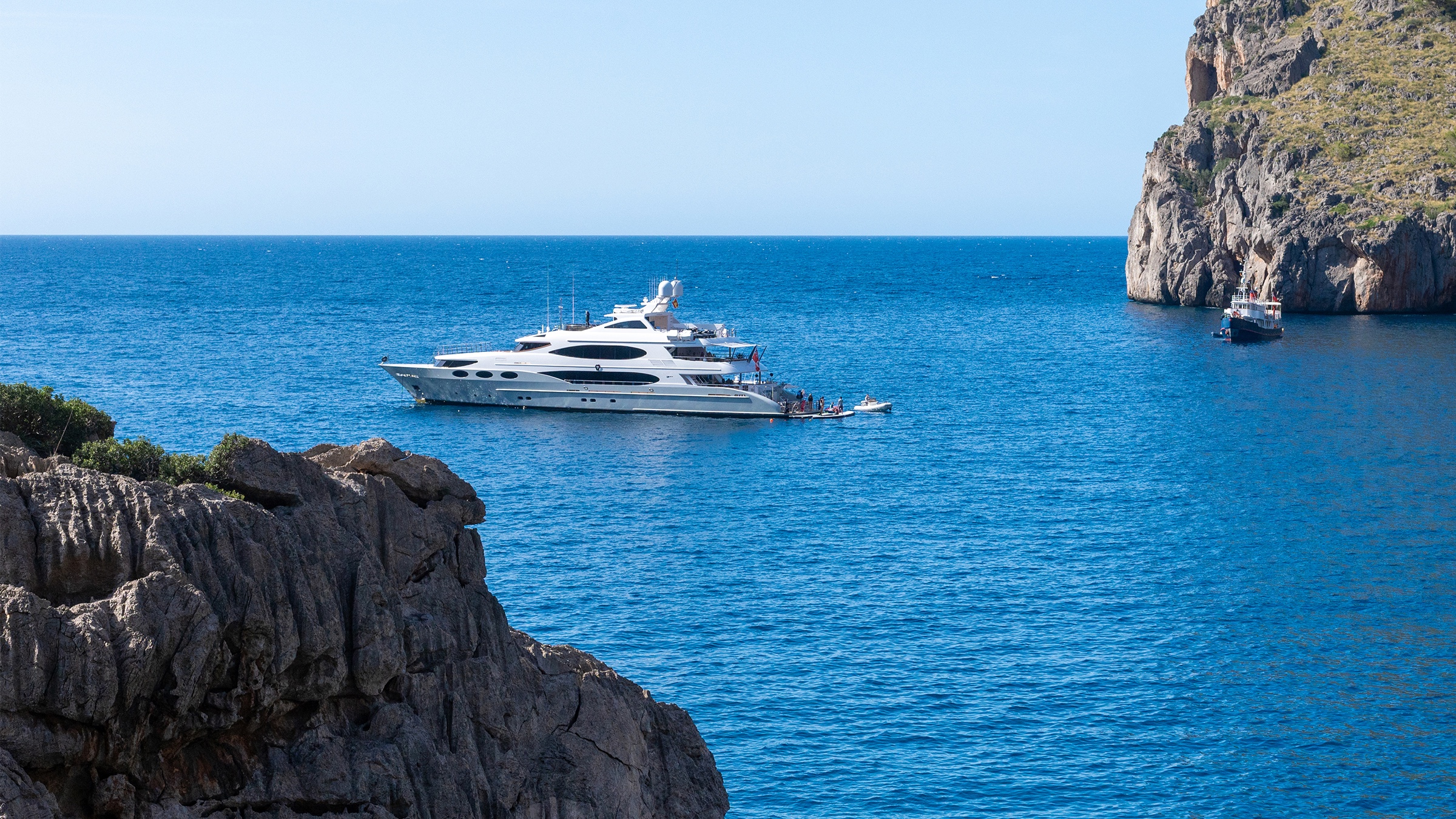 Sa Calobra hidden beach with yachts, Mallorca