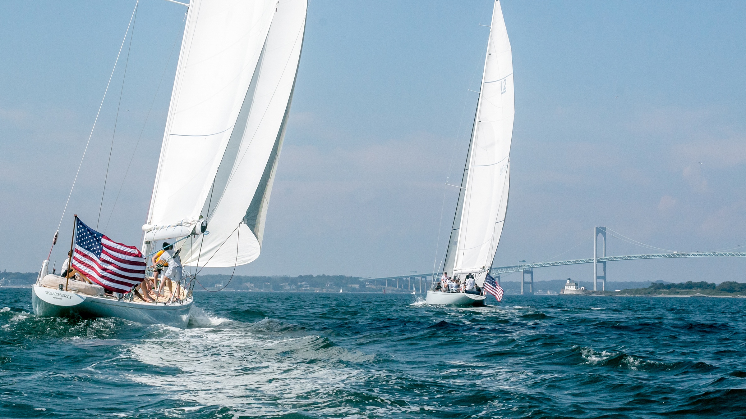Two sailboats racing one behind the other off Newport