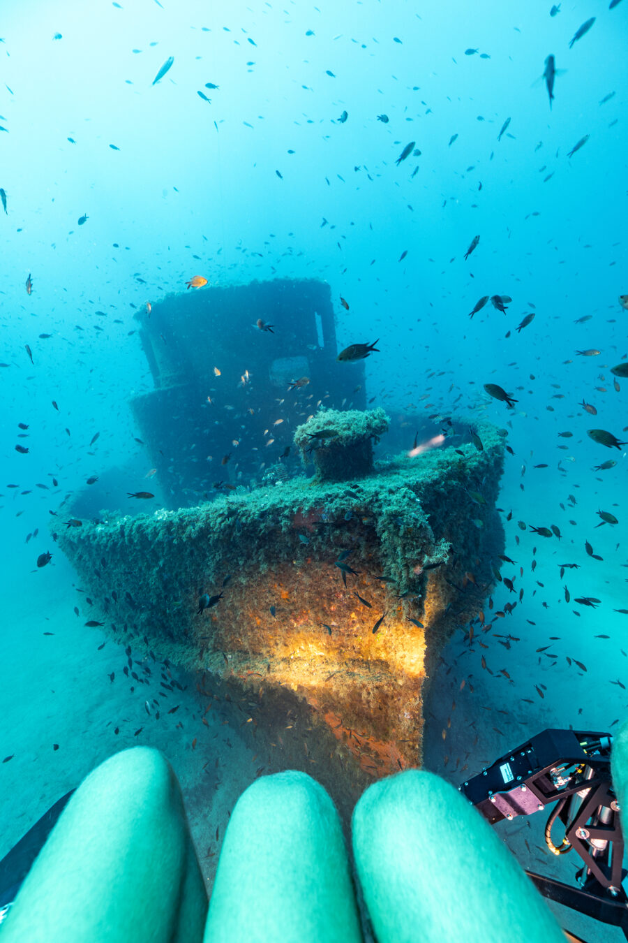 A wreck in sharp focus, seen from inside a submersible