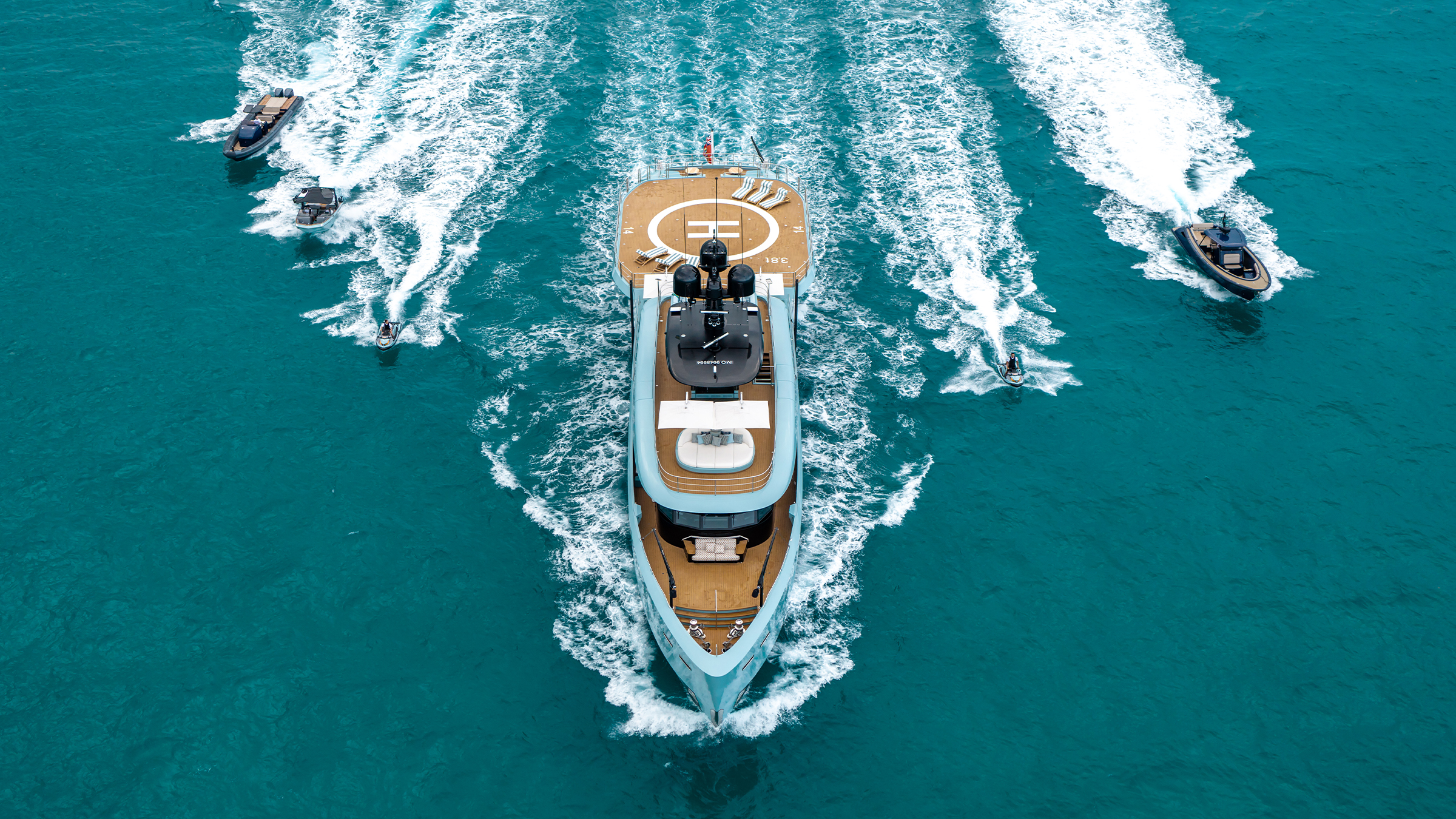 Limerence running with tenders and wave runners alongside