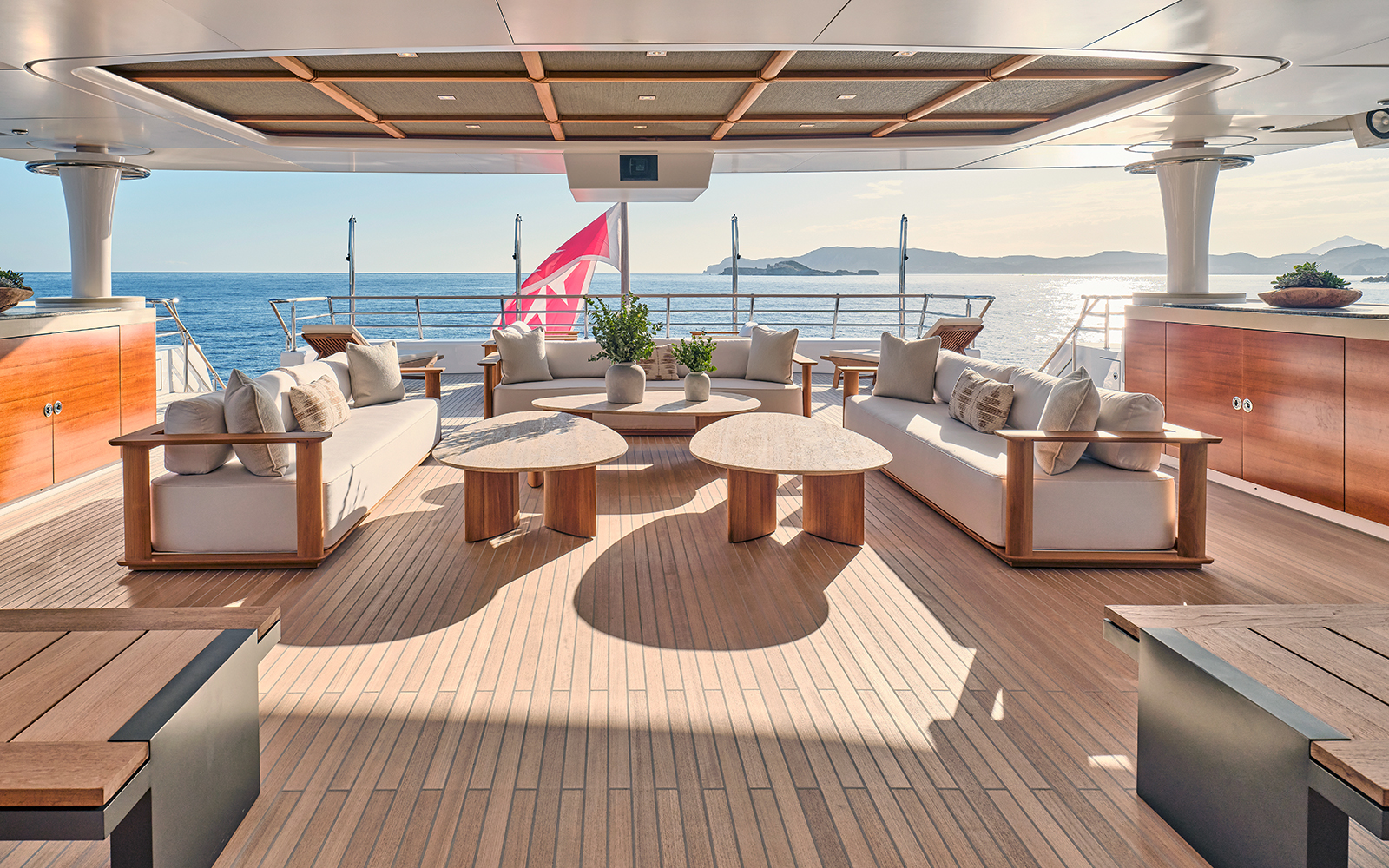 Semi-covered aft lounge aboard, sea beyond