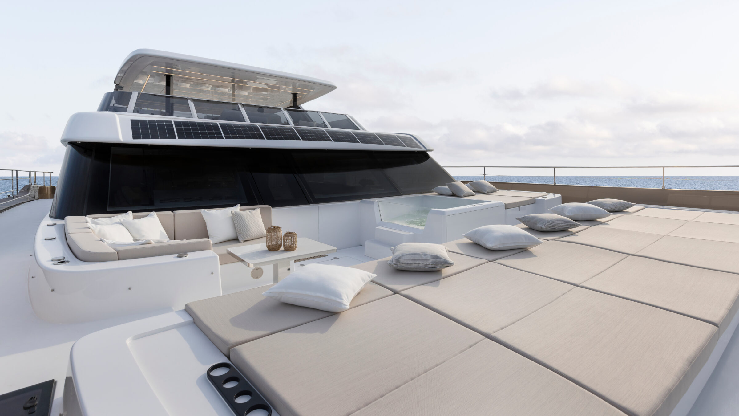 Foredeck of the 80 Sunreef Power Eco with sunpad, sofa and spa pool