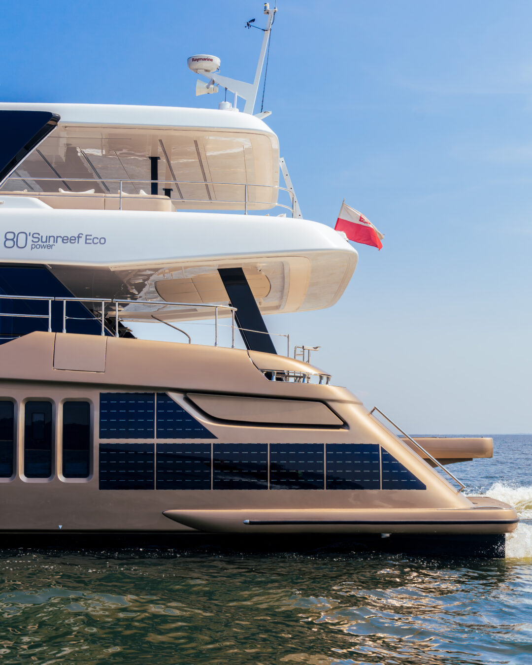 Side detail of the stern of the 80 Sunreef Power Eco, with solar panels in the hull and the flybridge above